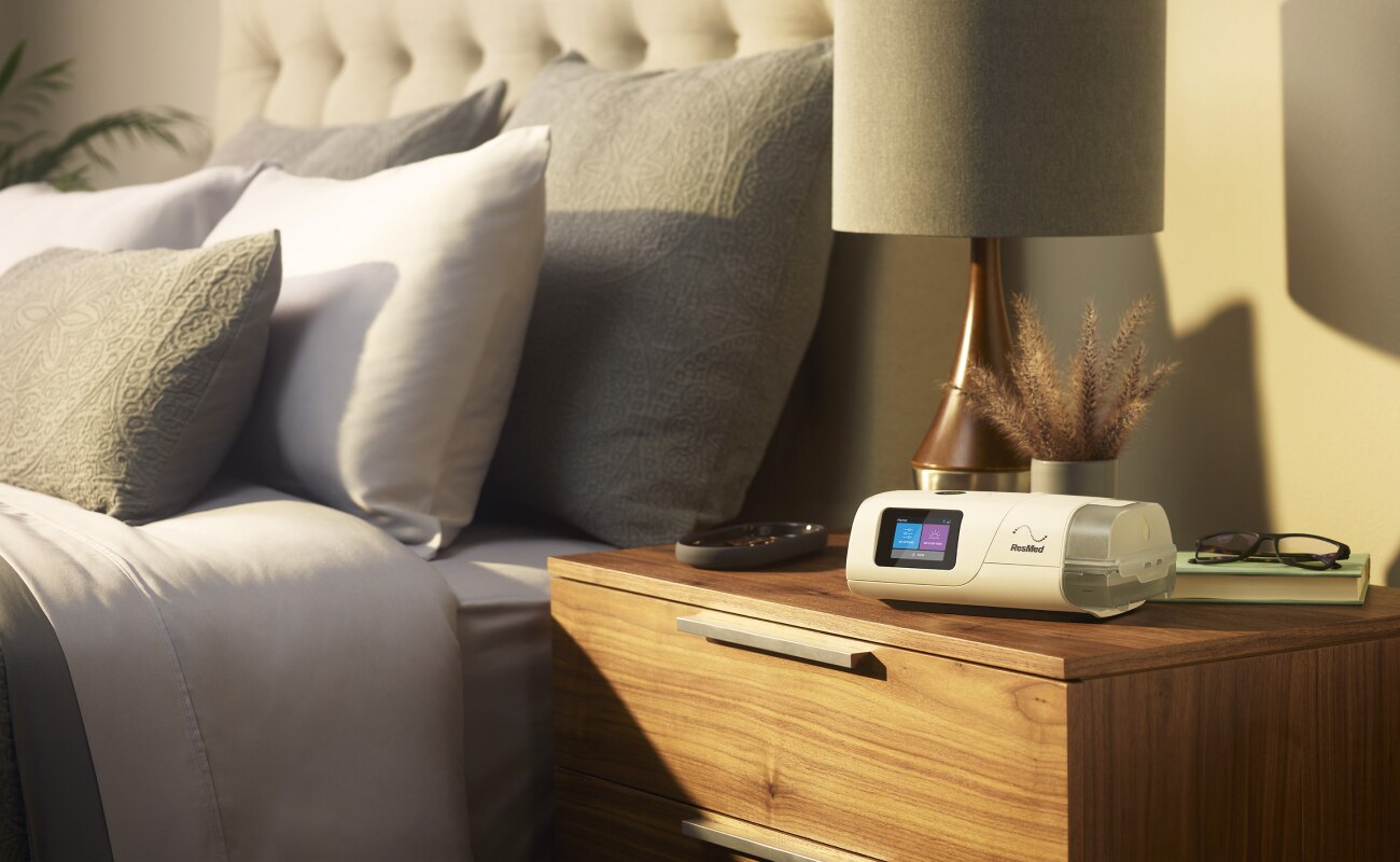 An Air11 device on a bedside table in a patient’s home.
