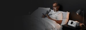 Patient BCO dans son lit avec machine LUMIS HFT