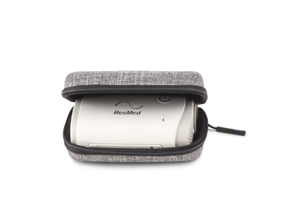 A cut-out of the grey AirMini hard travel case, with the zip open showing part of the AirMini device inside.